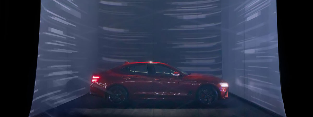 Projections on transparent scrim stirr the audiences curiosity at this car show
